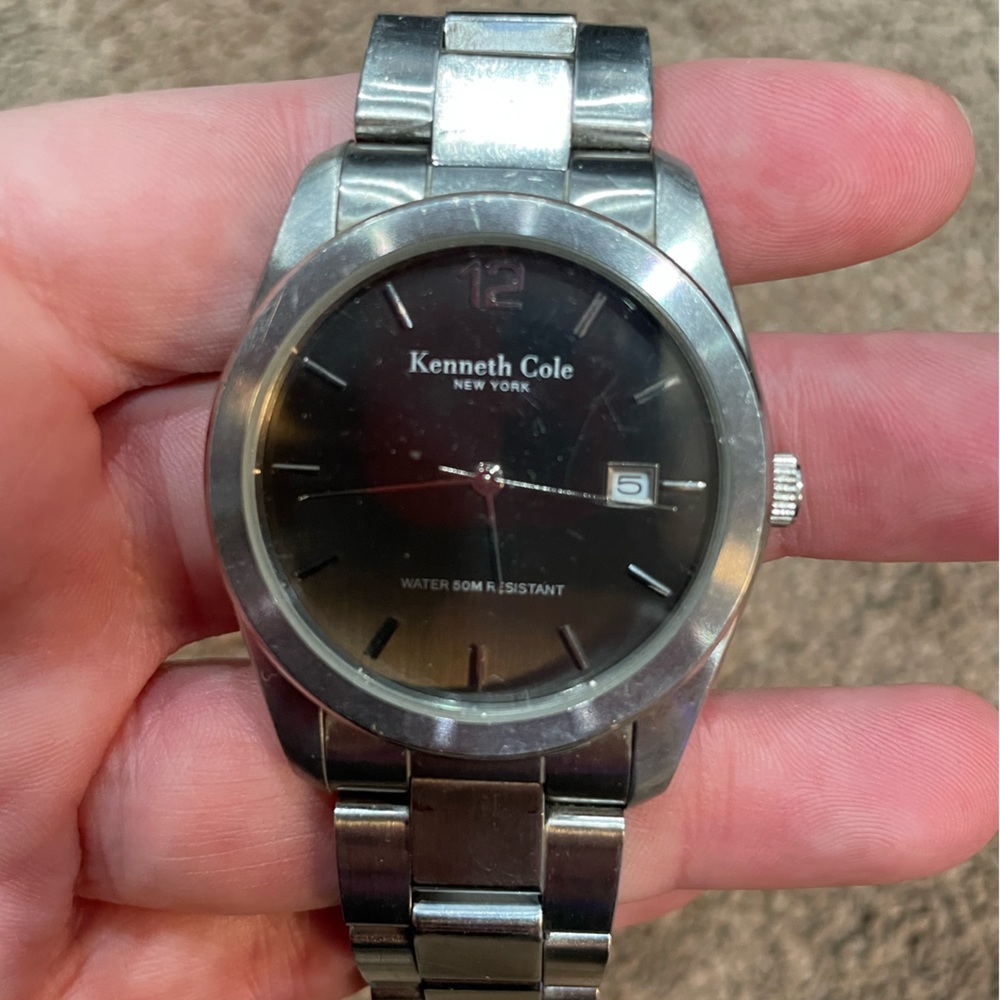 Kenneth Cole New York men’s Watch silver band black face.